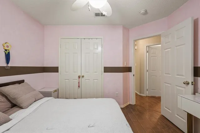 a bedroom with a bed and closet