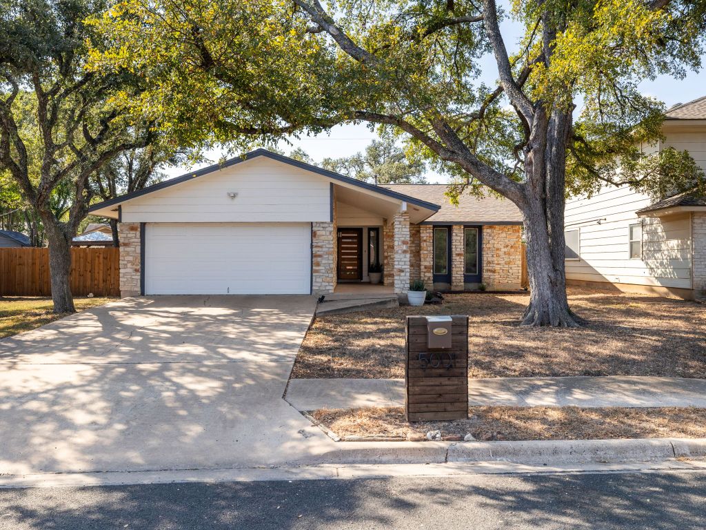 5001 Summerset Trail Austin, TX 78749 - Photo 2 of 11 a front view of a house with garage