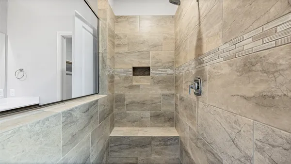 a bathroom with a double vanity sink mirror and double
