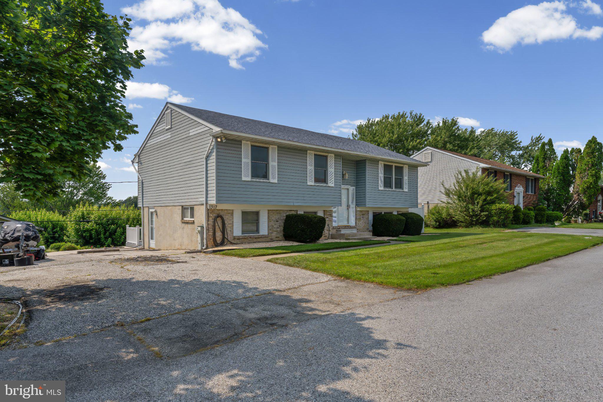 1317 Roxboro Road Baltimore, MD 21237 - Photo 3 of 30 Charming home with lush greenery.