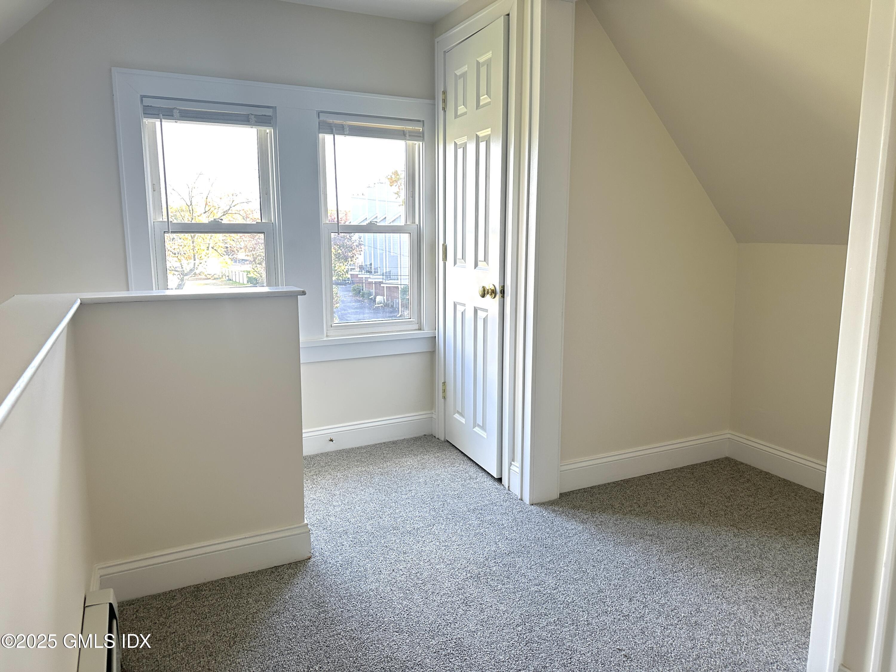 85 Strickland Road, Unit 2 Cos Cob, CT 06807 - Photo 15 of 26 a view of an empty room with a window