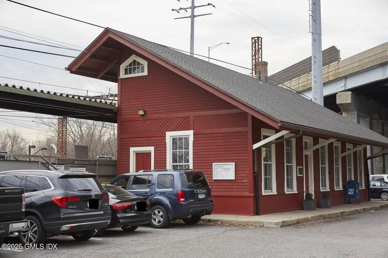 85 Strickland Road, Unit 2 Cos Cob, CT 06807 - Photo 21 of 26 a car parked in front of a building