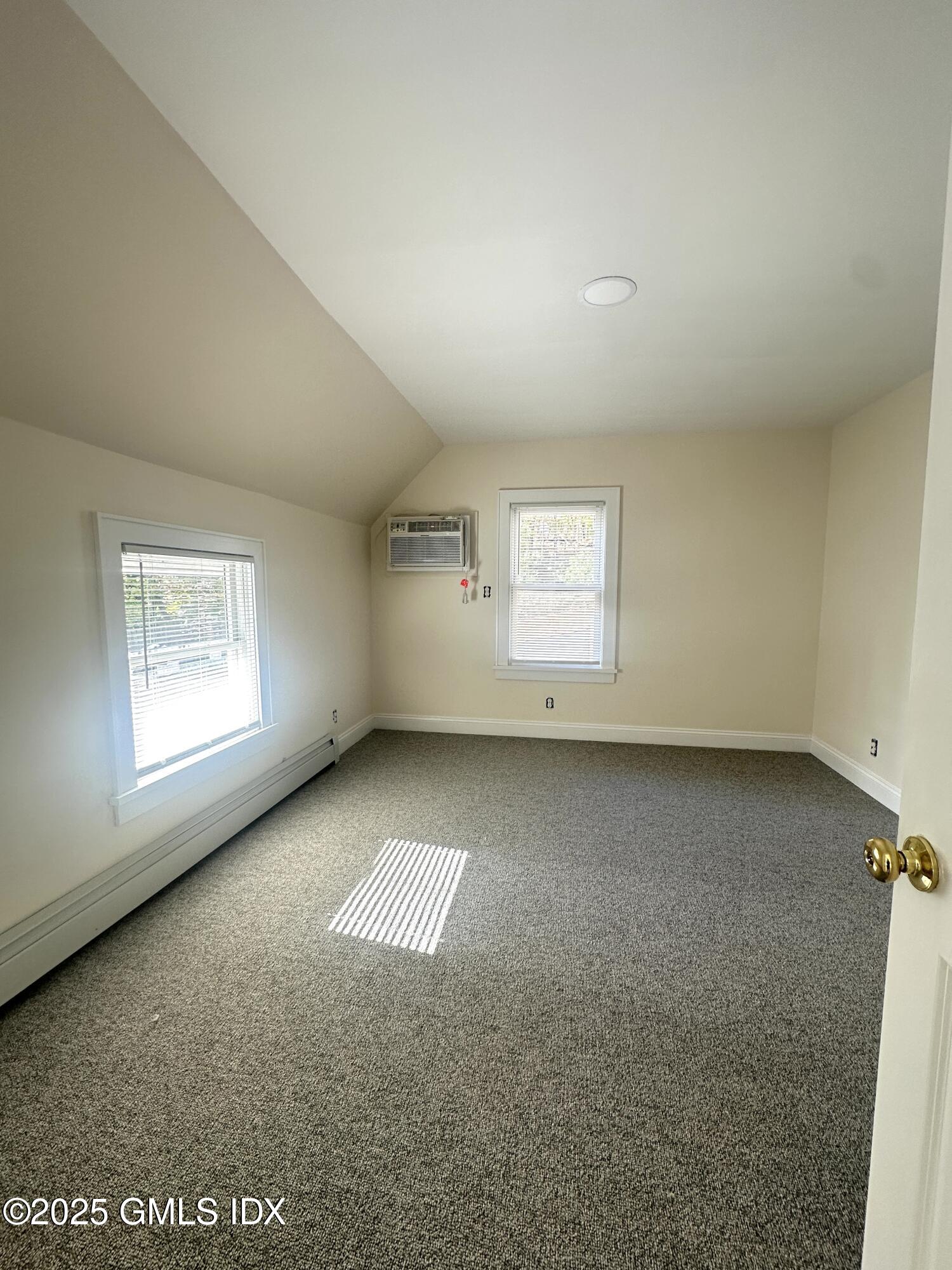 85 Strickland Road, Unit 2 Cos Cob, CT 06807 - Photo 8 of 26 an empty room with a window