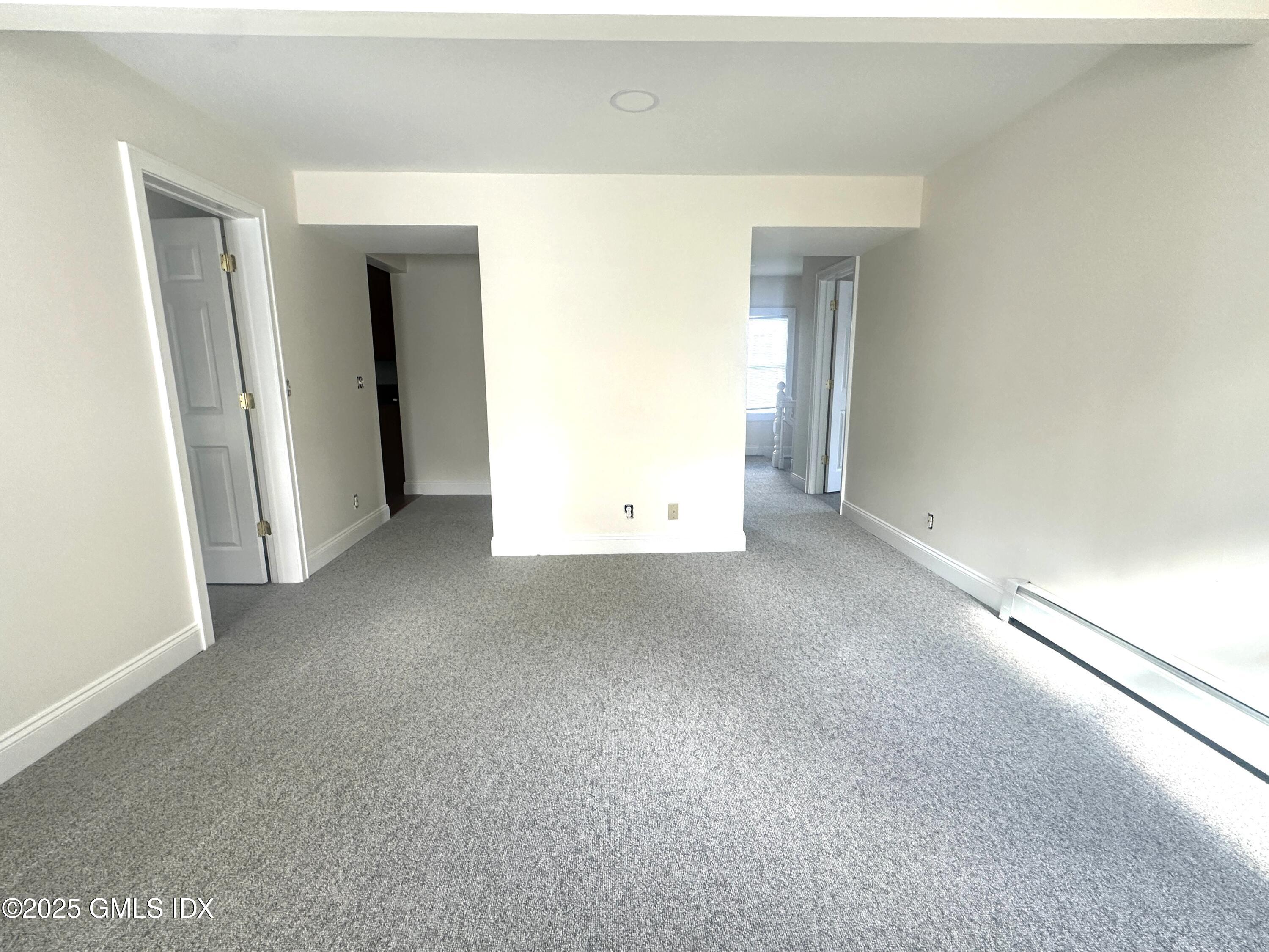 85 Strickland Road, Unit 2 Cos Cob, CT 06807 - Photo 10 of 26 a view of a room with an empty space
