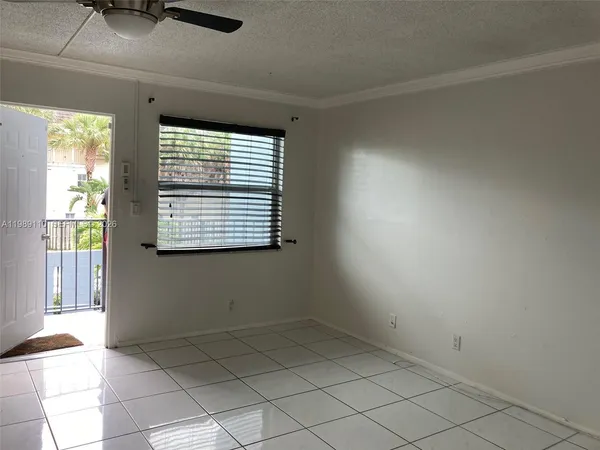 a view of an empty room and window