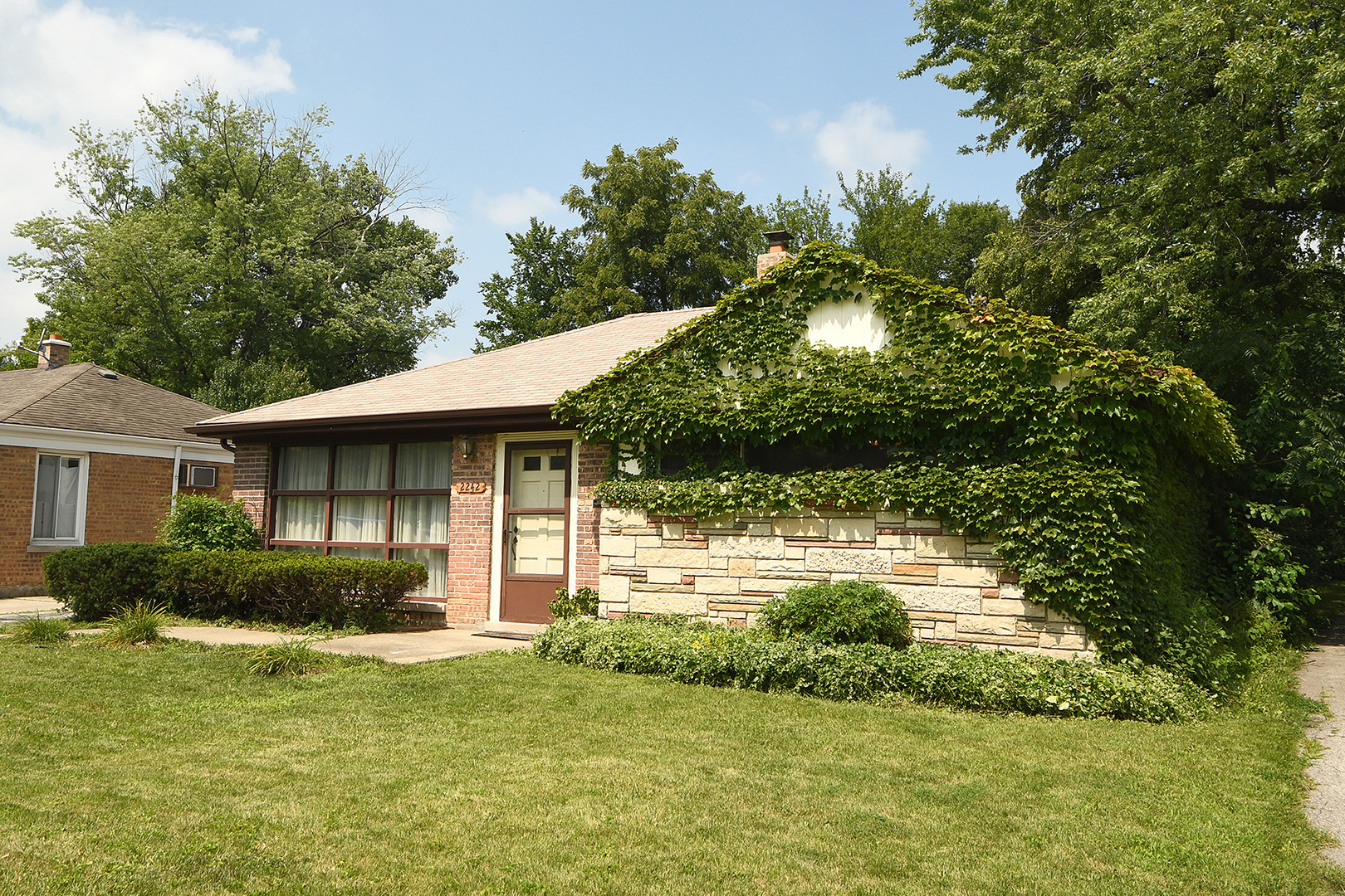 2242 Spruce Road Homewood, IL 60430 - Photo 12 of 15 a front view of a house with a yard