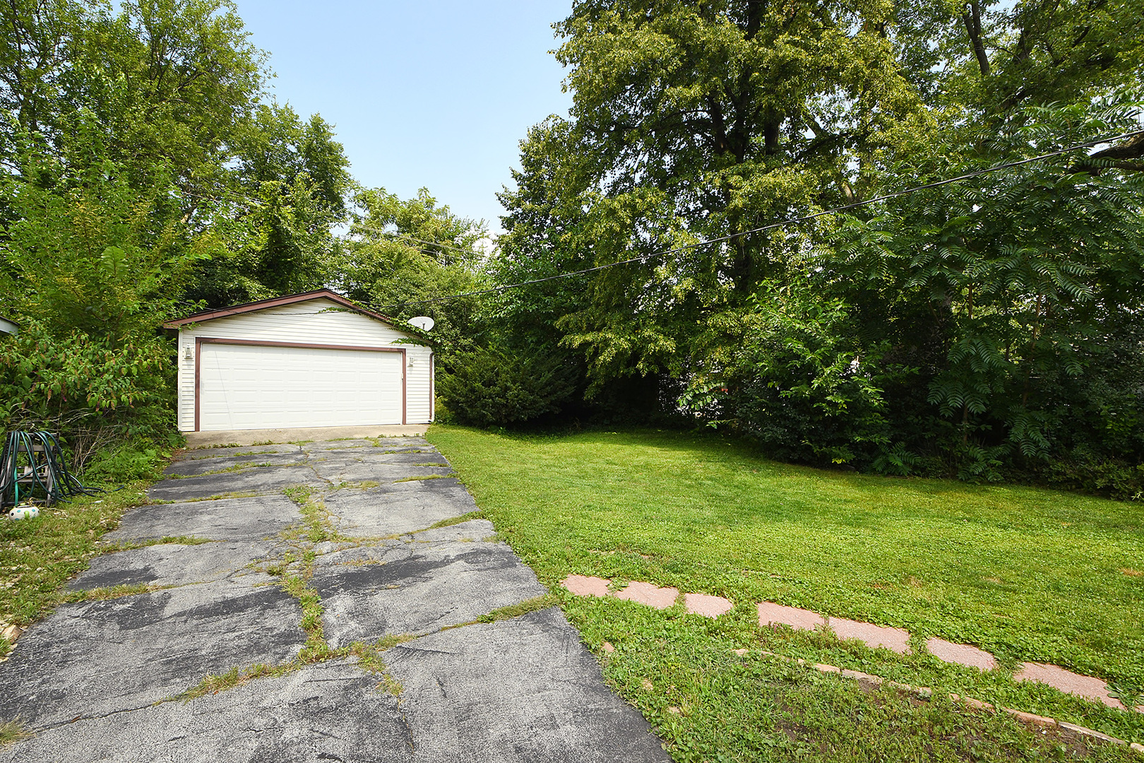 2242 Spruce Road Homewood, IL 60430 - Photo 13 of 15 a front view of a house with a garden