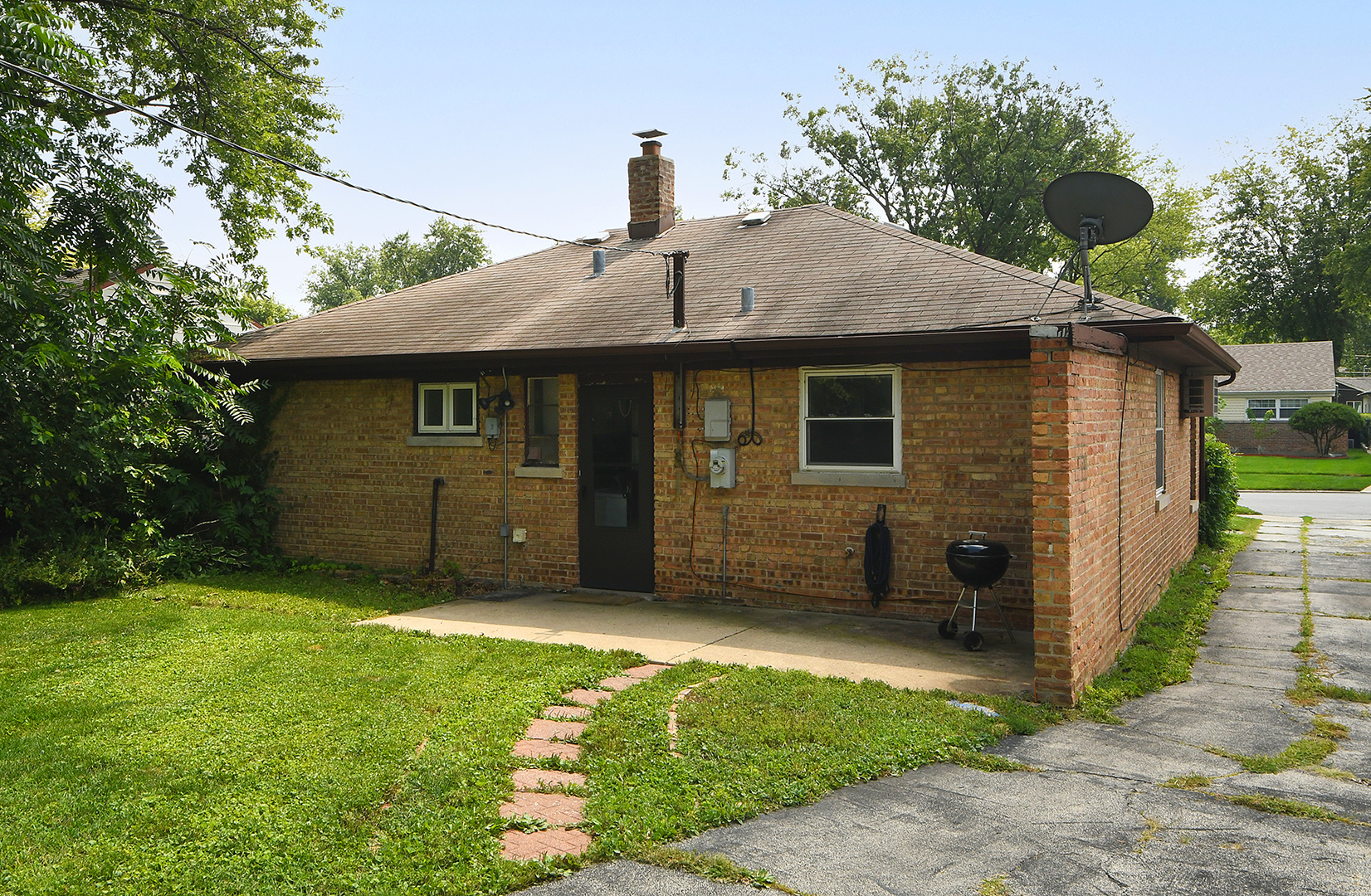 2242 Spruce Road Homewood, IL 60430 - Photo 15 of 15 a front view of a house with a garden