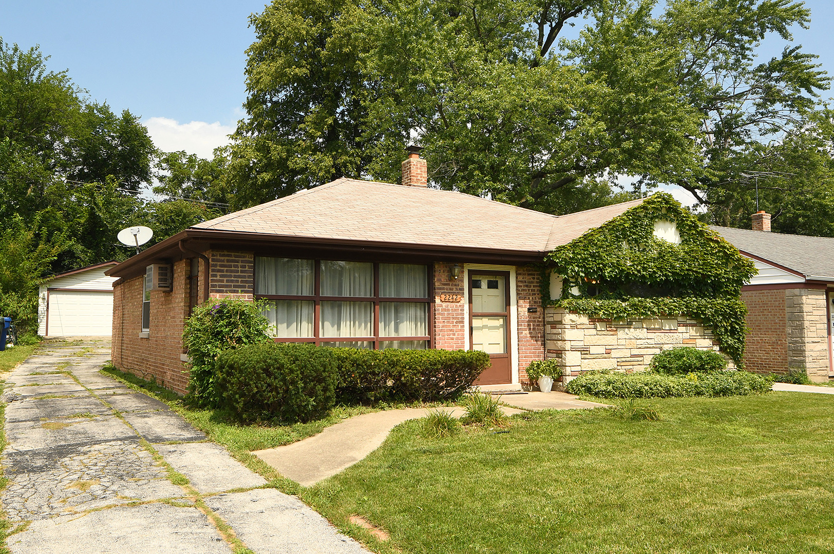 2242 Spruce Road Homewood, IL 60430 - Photo 2 of 15 a front view of a house with a yard
