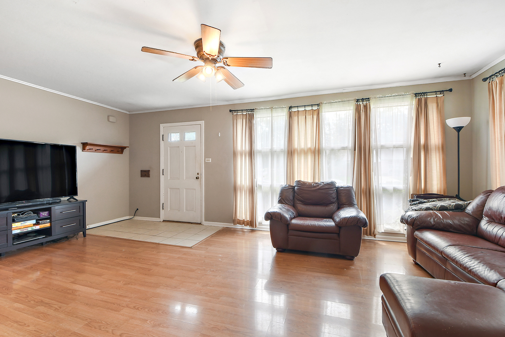 2242 Spruce Road Homewood, IL 60430 - Photo 6 of 15 a living room with furniture and a flat screen tv