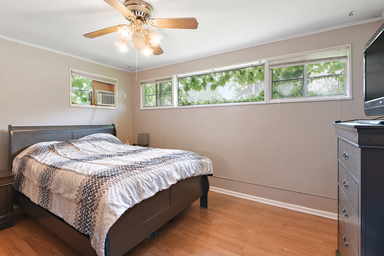 2242 Spruce Road Homewood, IL 60430 - Photo 8 of 15 a bed sitting in a bedroom next to a window