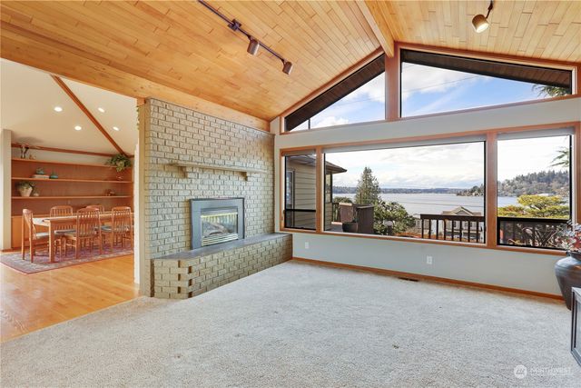 a view of an empty room with a fireplace