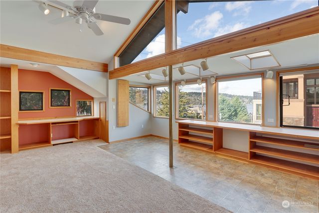 an empty room with large window