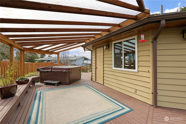 a view of a balcony with furniture