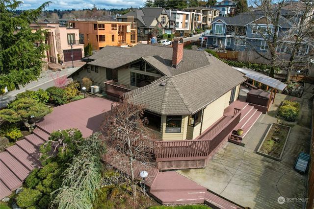 an aerial view of a house with garden space and sitting area