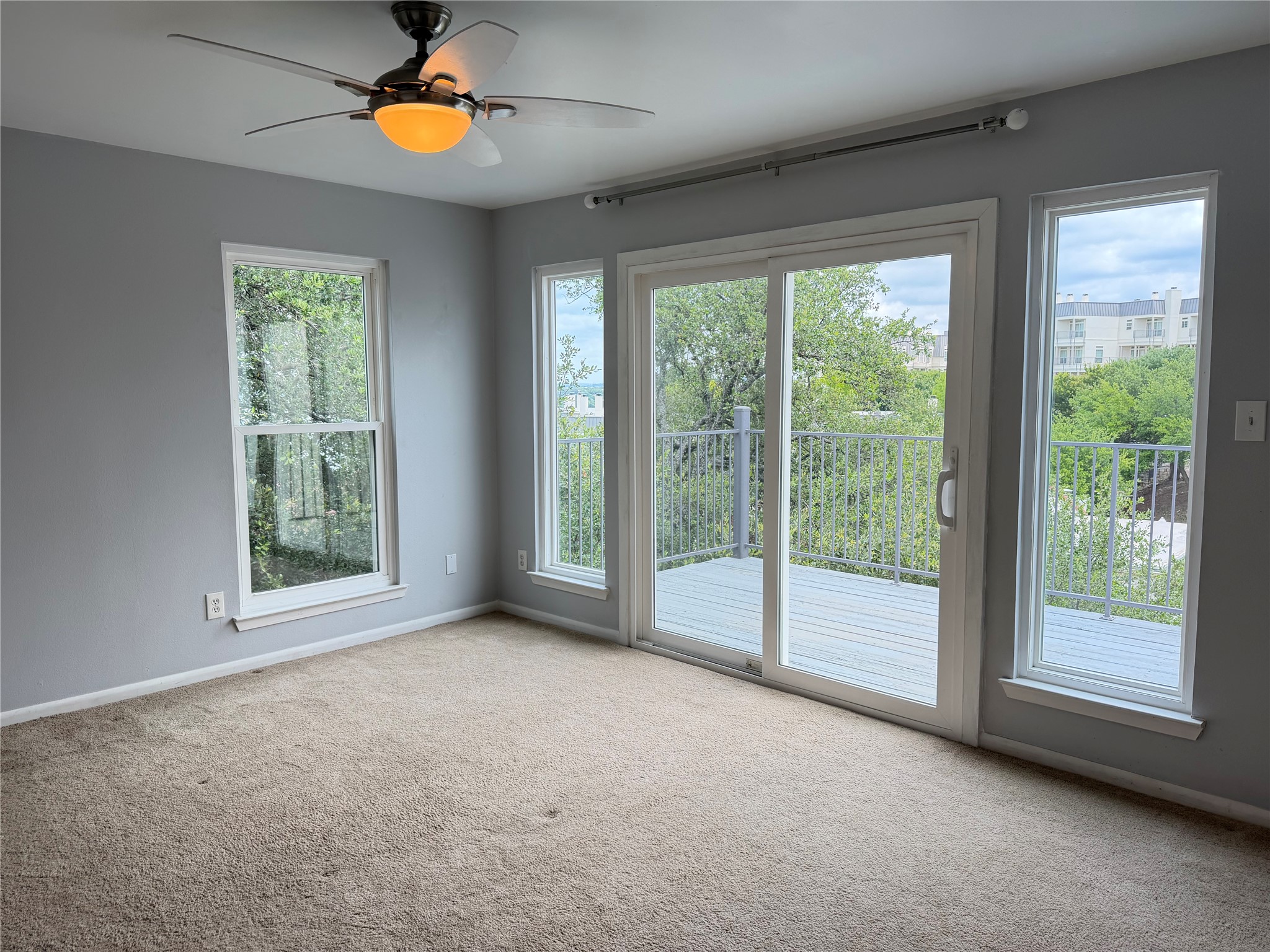 2918 Ranch Road 620 North, Unit C120 Austin, TX 78734 - Photo 18 of 34 The primary bedroom is spacious with a sliding glass door that opens to a private balcony, offering views of Lake Travis .