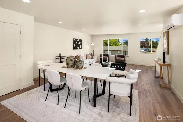 a view of a dining room with furniture window and wooden floor