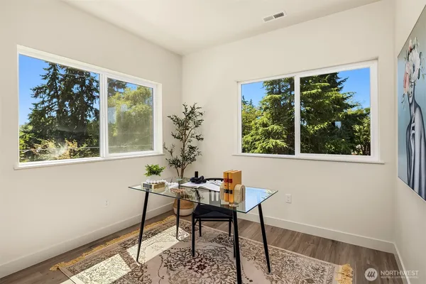 a workspace with furniture and a window