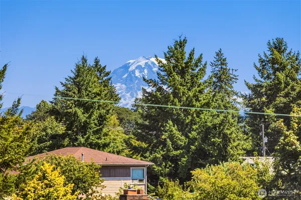 a view of a house with a tree