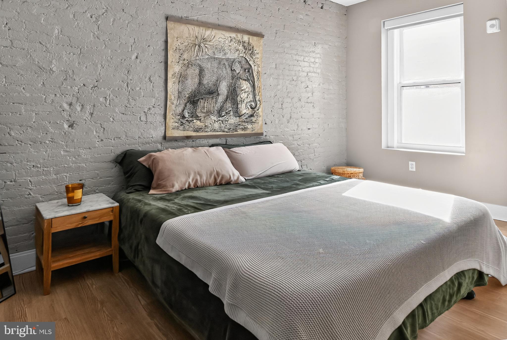 459 Massachusetts Avenue Northwest, Unit 24 Washington, DC 20001 - Photo 14 of 18 a bedroom with a bed and a window