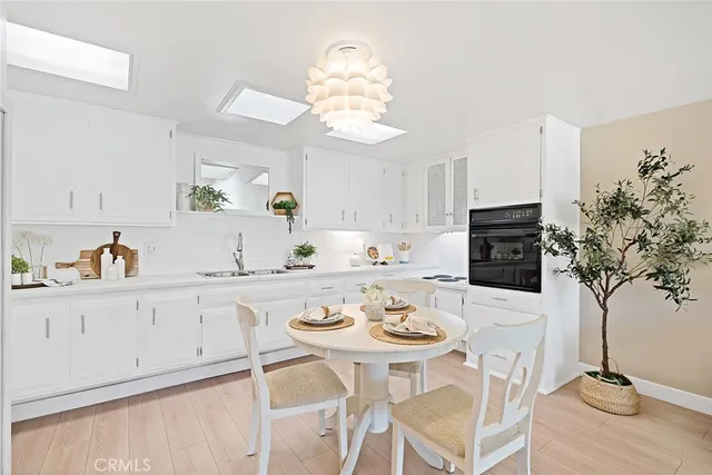 a kitchen with a table and chairs in it