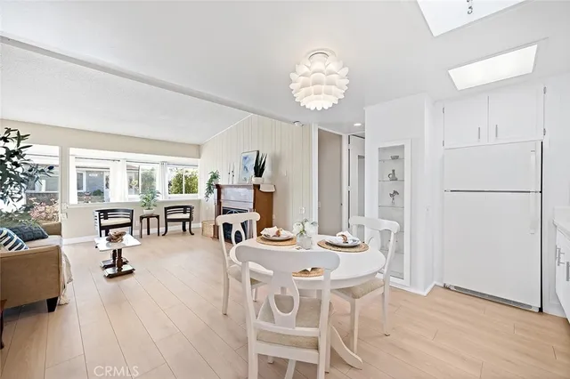 a view of a dining room with furniture and a livingroom