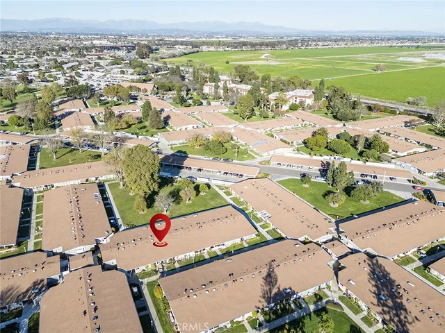 an aerial view of residential houses with outdoor space