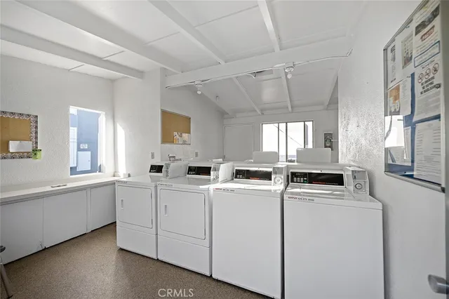 a kitchen that has a sink and a stove in it