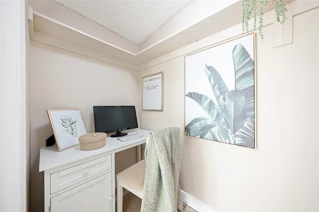 a view of workspace with wooden floor windows