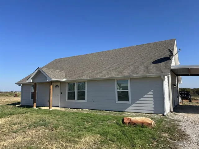 a backyard of a house with seating space