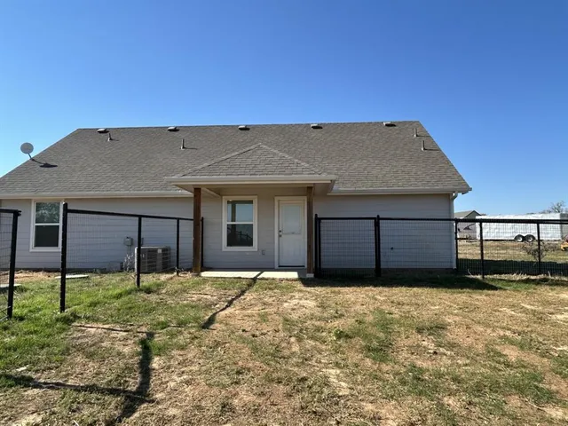 a house with yard in front of it