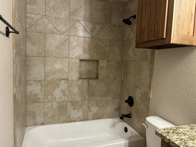 a bathroom with a bath tub and a shower