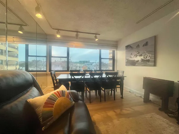 a view of a dining room with furniture window and outside view