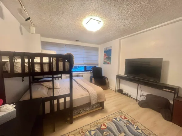 a bedroom with a bed and a walk in closet
