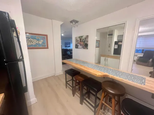 a room with wooden floor and furniture
