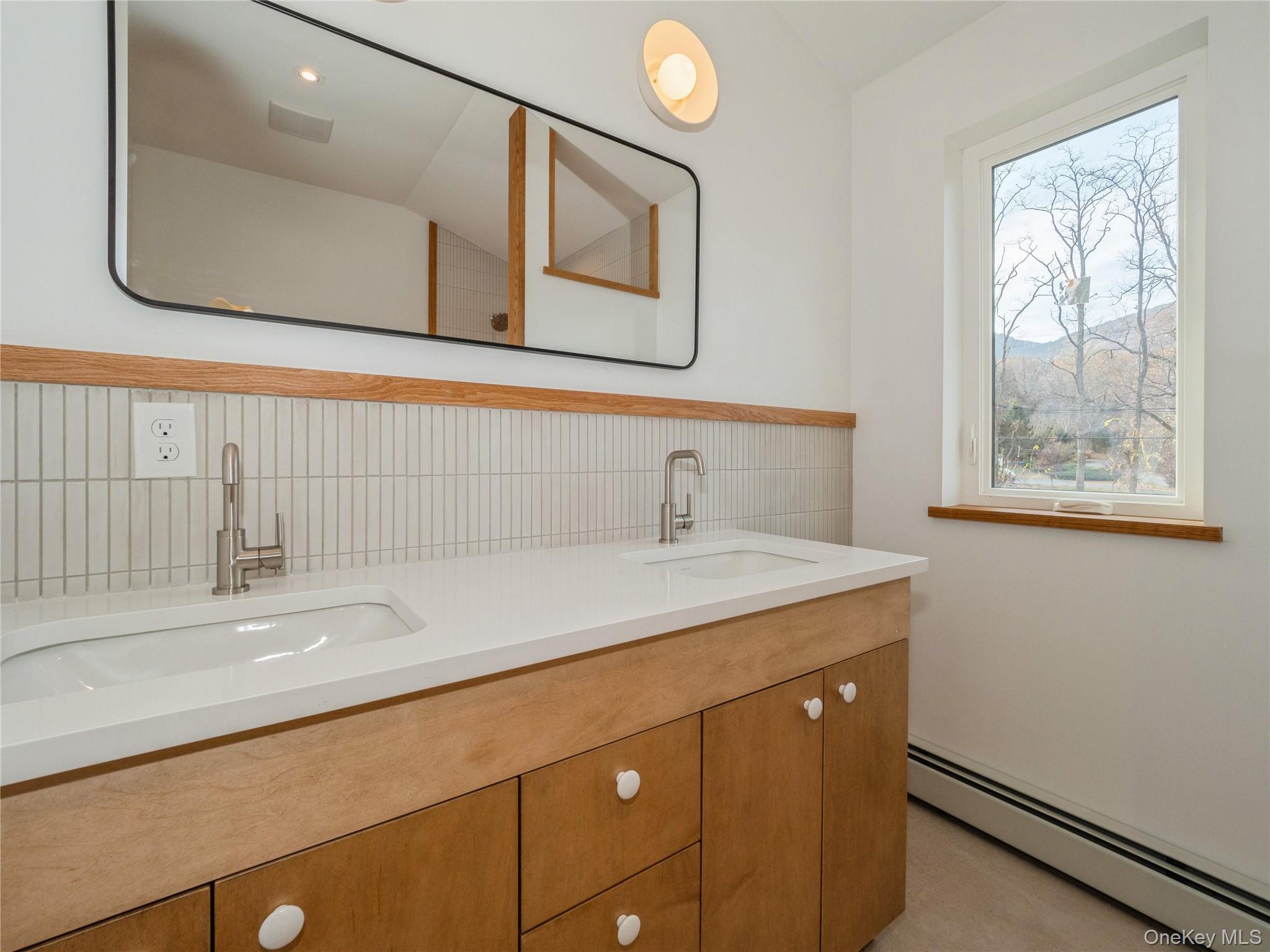 50 Old Albany Post Road North, Unit #1 Cold Spring, NY 10516 - Photo 12 of 18 a bathroom with a sink and a mirror