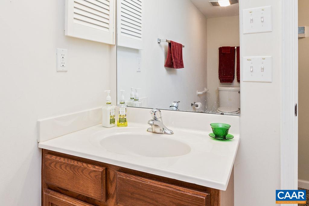 2080 Stone Ridge Wintergreen, VA 22967 - Photo 23 of 34 a bathroom with a sink and a mirror
