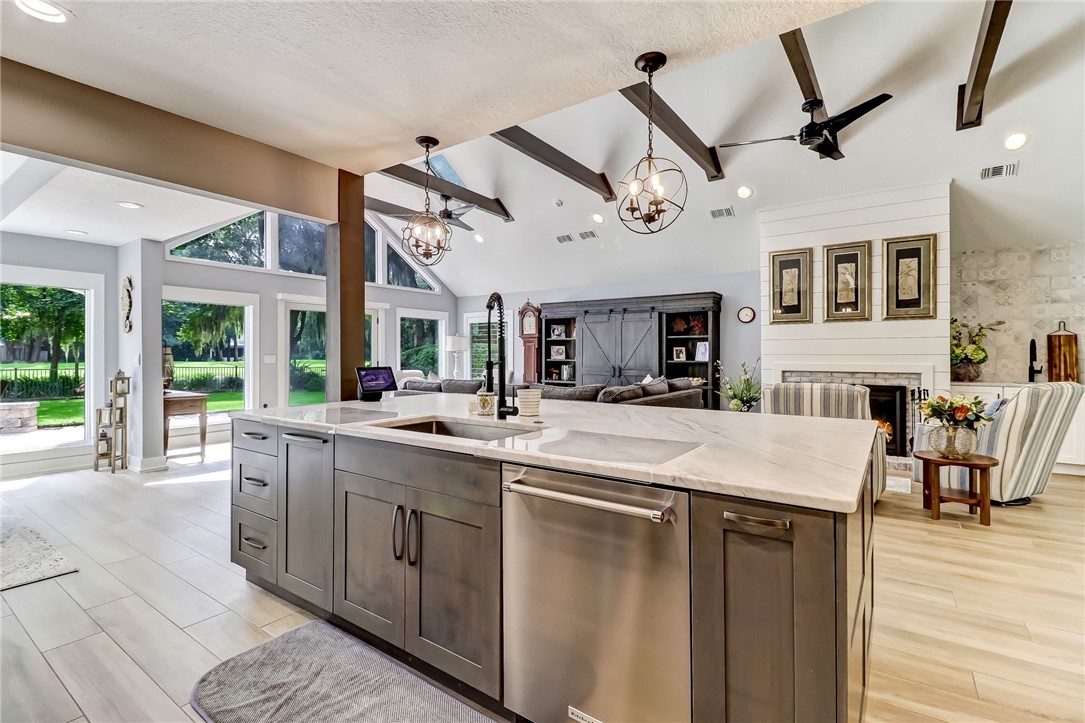 75 Sea Marsh Road Fernandina Beach, FL 32034 - Photo 11 of 30 a large kitchen with stainless steel appliances granite countertop a sink and cabinets