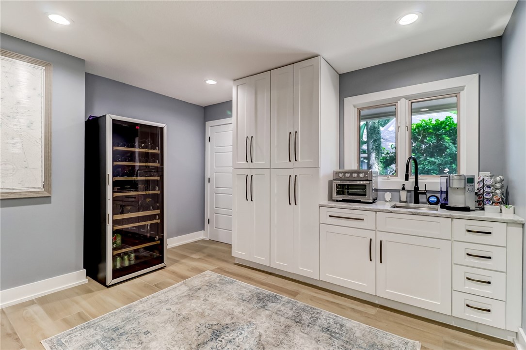 75 Sea Marsh Road Fernandina Beach, FL 32034 - Photo 13 of 30 a kitchen with white cabinets and window