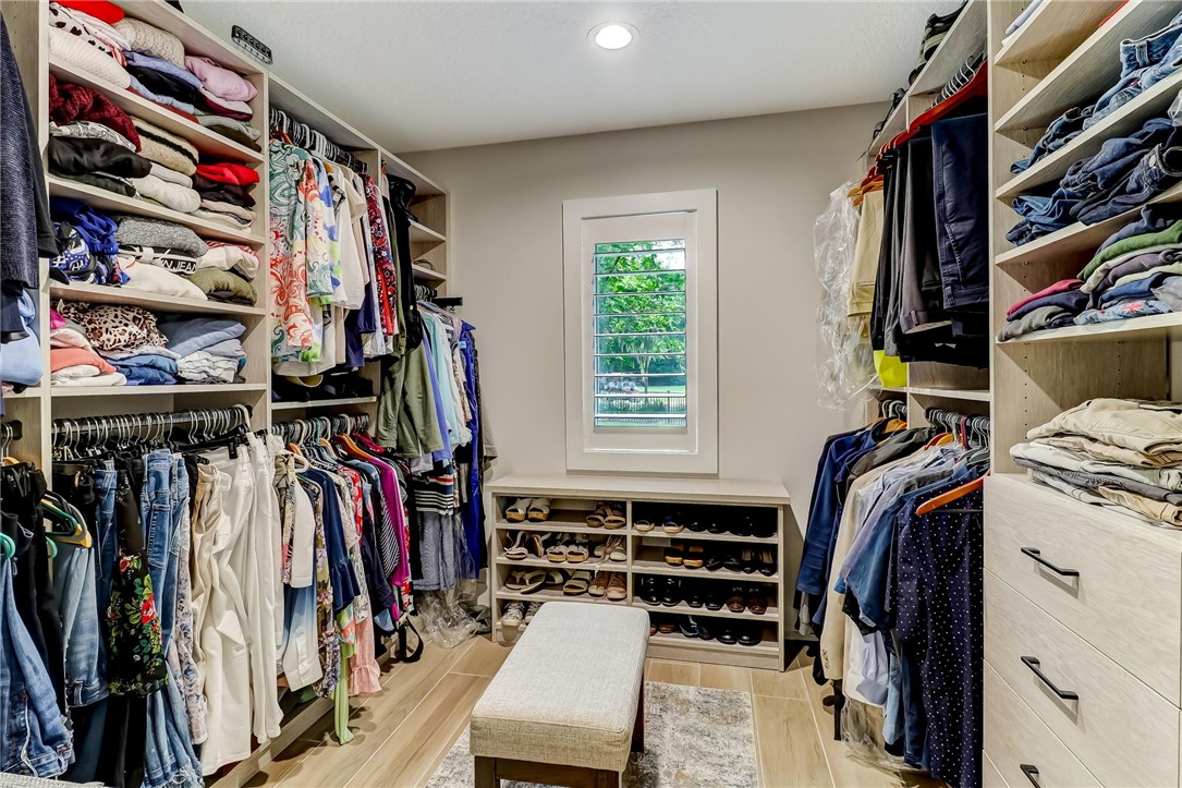 75 Sea Marsh Road Fernandina Beach, FL 32034 - Photo 16 of 30 a view of walk in closet with clothes and shoes