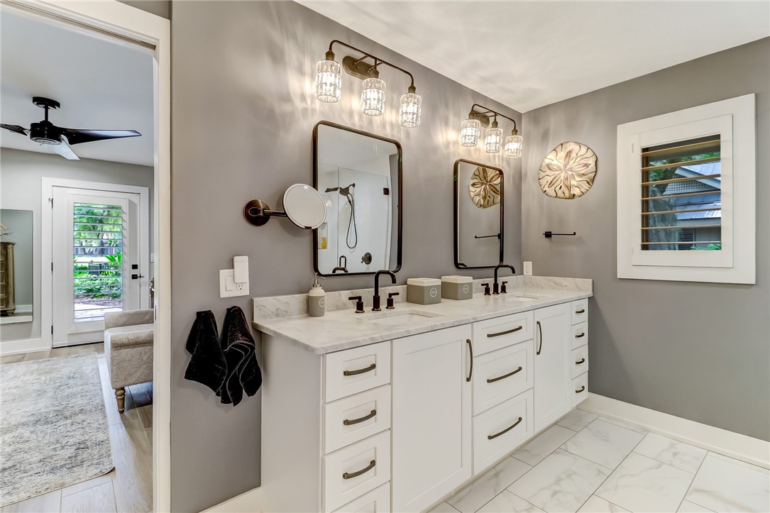 75 Sea Marsh Road Fernandina Beach, FL 32034 - Photo 17 of 30 a bathroom with a double vanity sink and a mirror