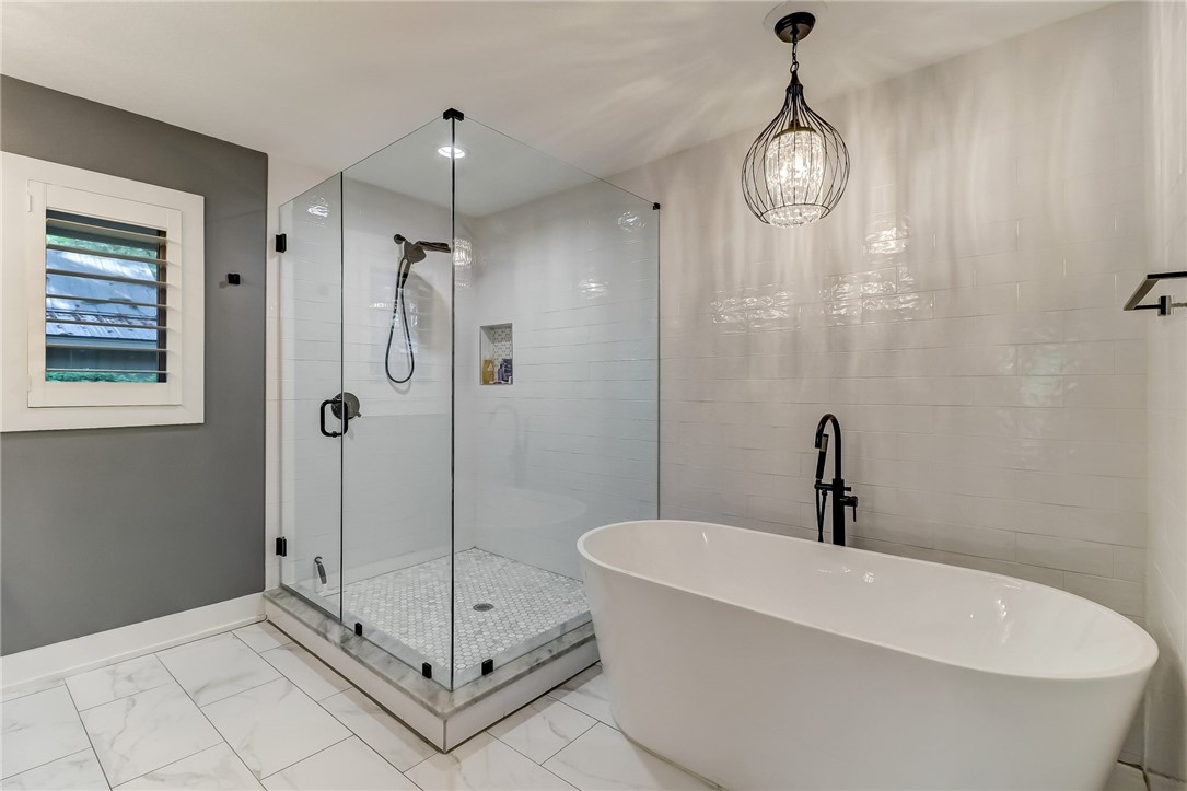 75 Sea Marsh Road Fernandina Beach, FL 32034 - Photo 18 of 30 a bathroom with a sink and shower