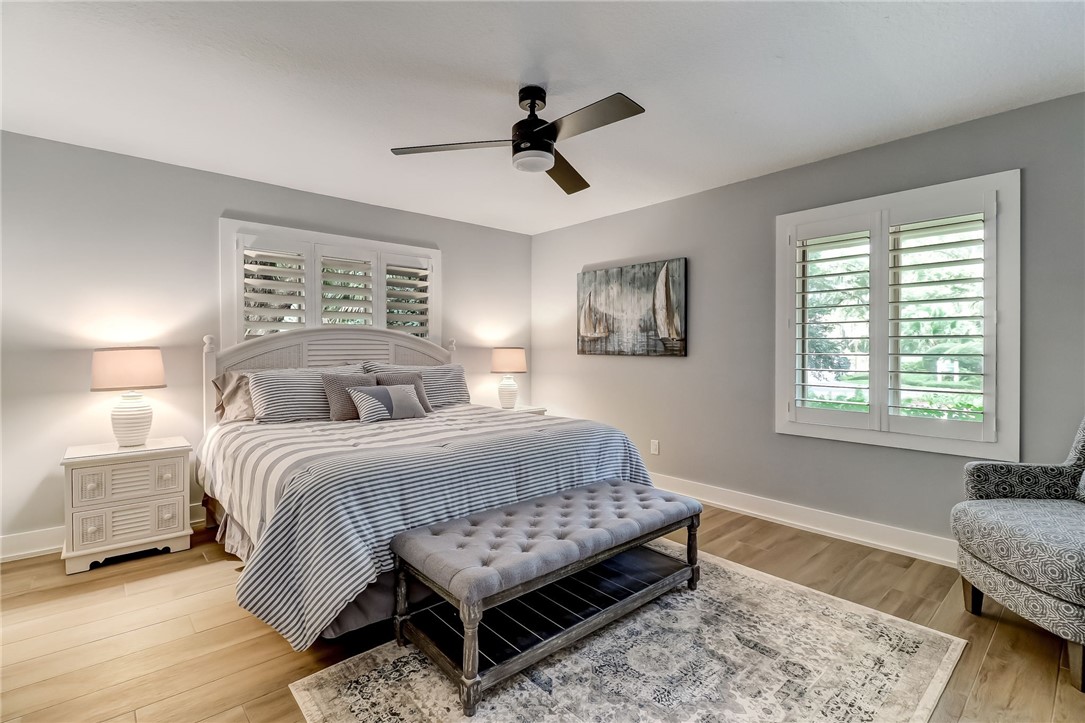 75 Sea Marsh Road Fernandina Beach, FL 32034 - Photo 19 of 30 a bedroom with a bed and a couch