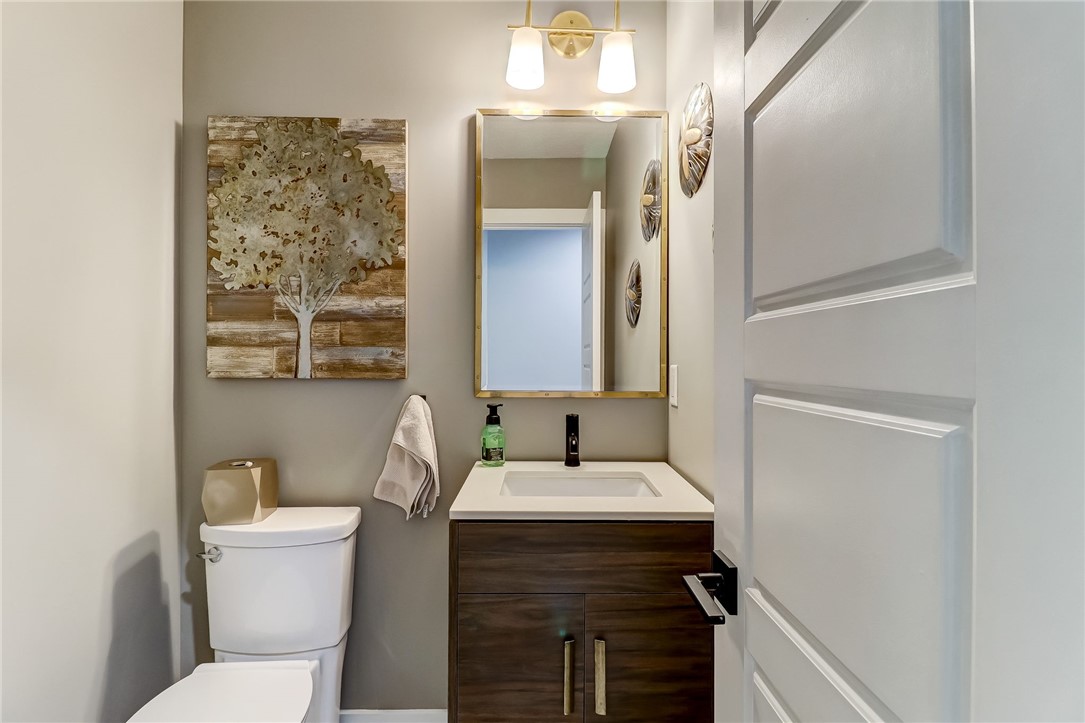 75 Sea Marsh Road Fernandina Beach, FL 32034 - Photo 25 of 30 a bathroom with a toilet sink and mirror