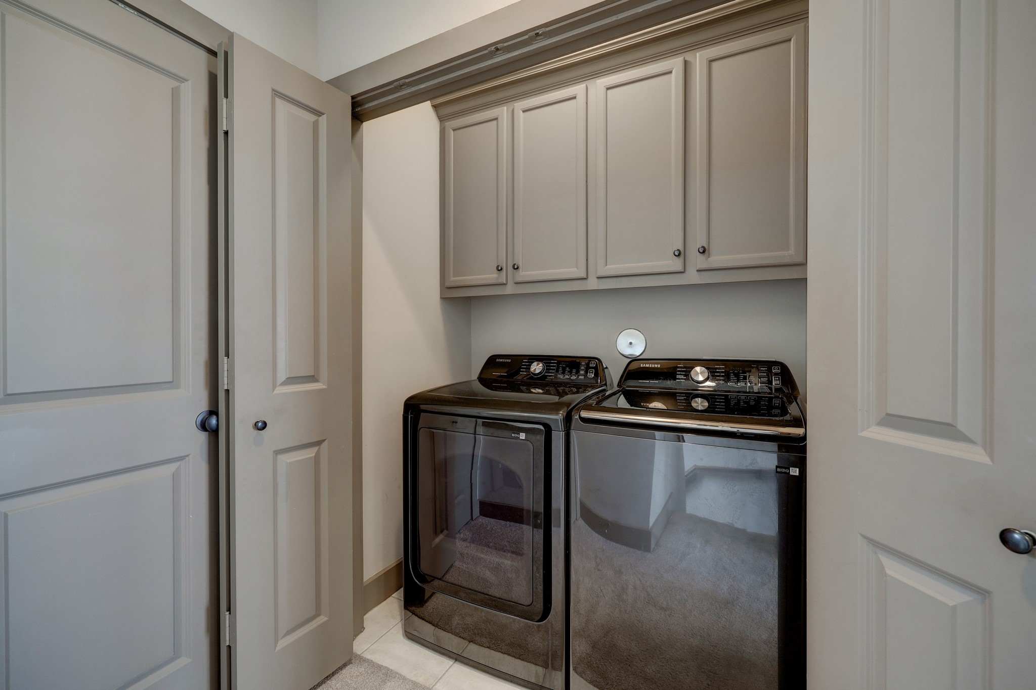 953 Patterson Street Houston, TX 77007 - Photo 13 of 14 a kitchen with stainless steel appliances granite countertop white cabinets and a stove