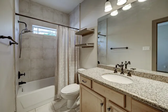 a kitchen with stainless steel appliances granite countertop a stove microwave and refrigerator