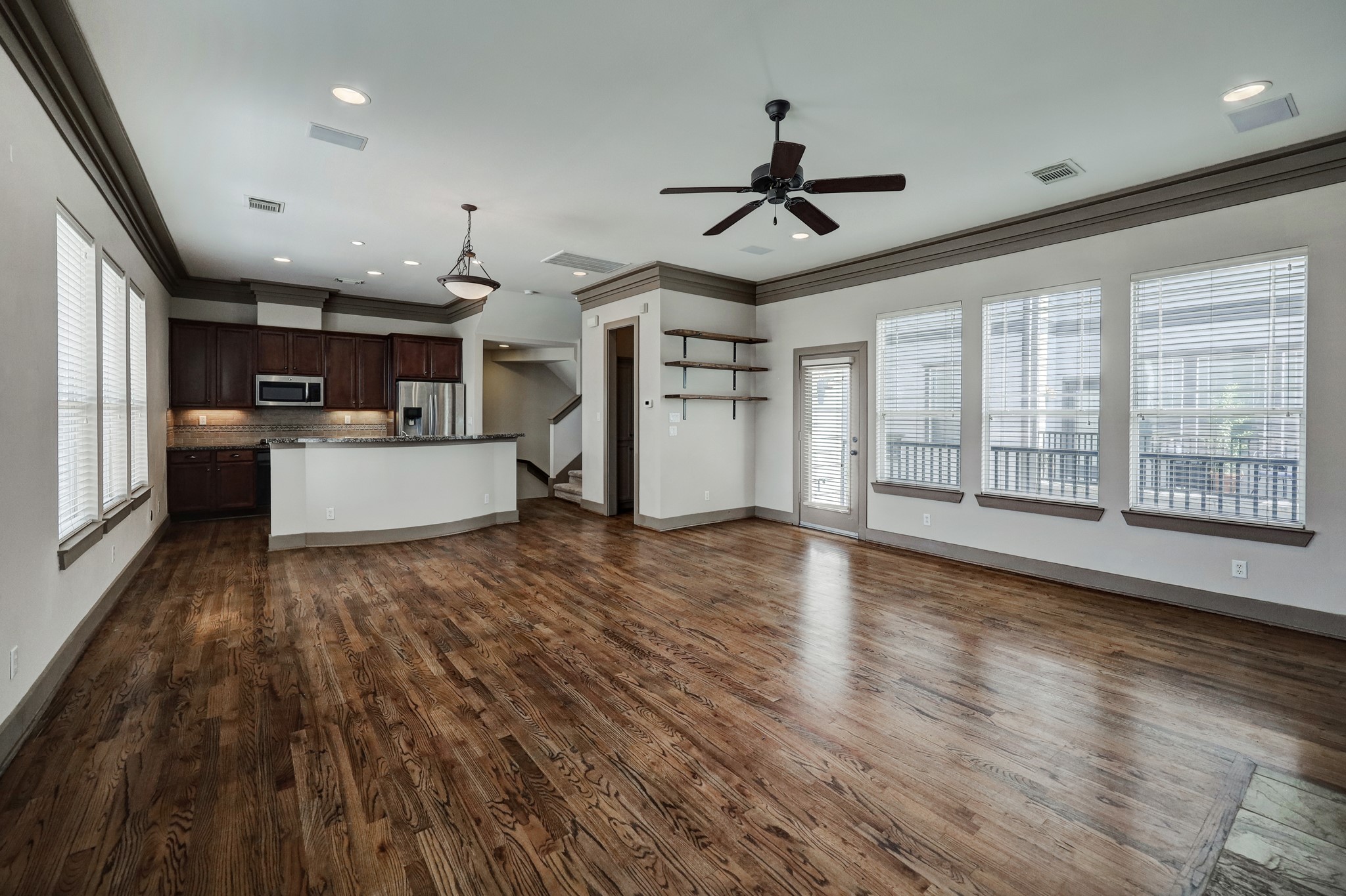 953 Patterson Street Houston, TX 77007 - Photo 7 of 14 a view of a kitchen with a stove cabinets and wooden floor