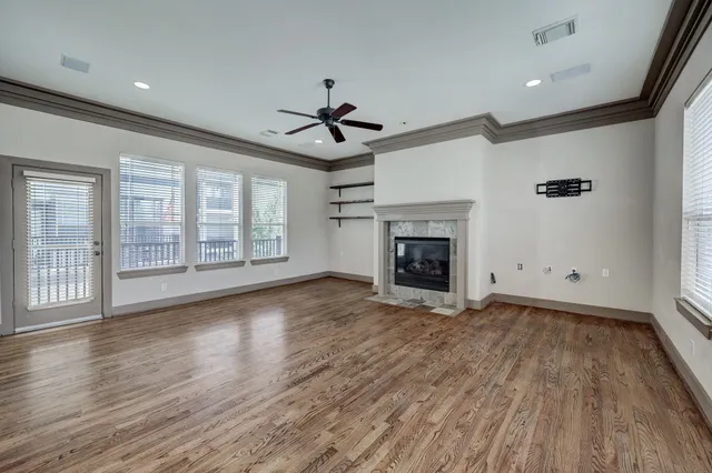 a view of a livingroom with a ceiling fan and window