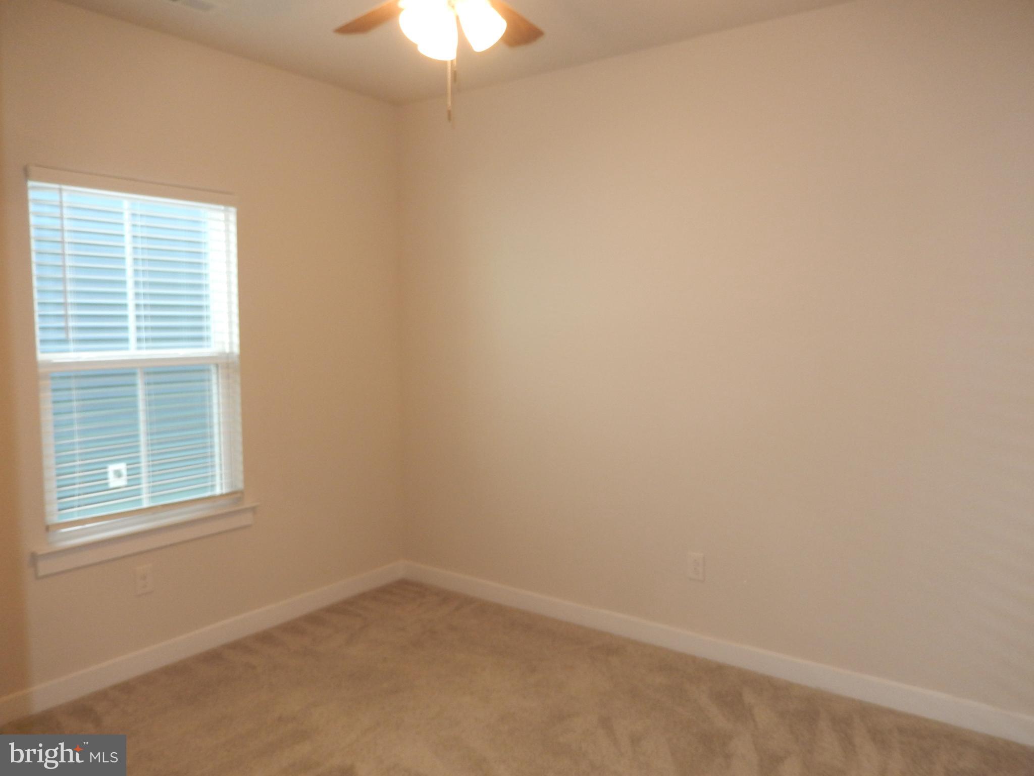 36884 Red Cedar Loop Ocean View, DE 19970 - Photo 35 of 50 an empty room with a window