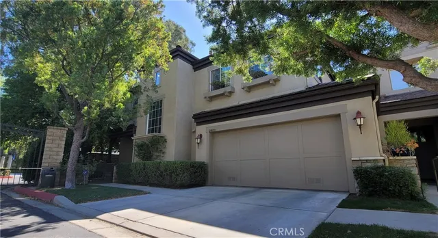a view of a chairs and table in the patio